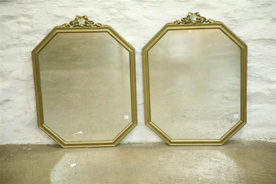 Appraisal: PAIR OF MIRRORS Twentieth century Octagonal mirrors with carved and