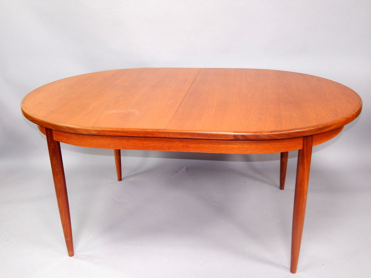 Appraisal: A 'G' plan teak retro style extending dining table the