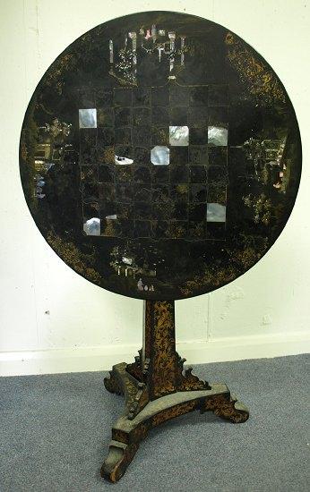 Appraisal: A Victorian black lacquer table the top with mother-of-pearl inlay