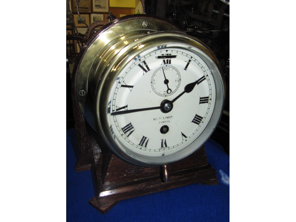 Appraisal: Brass cased ship's clock in oak stand