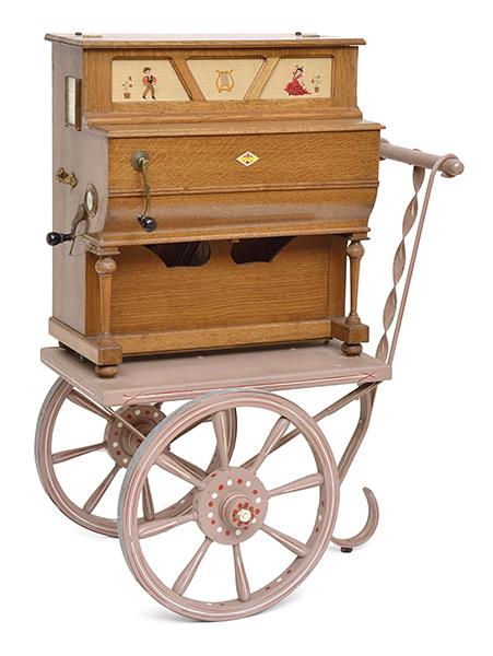 Appraisal: A SPANISH PIANO MUSIC BOX ON CART cm high