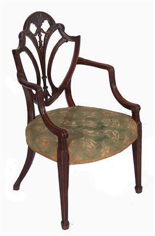 Appraisal: A GEORGE III MAHOGANY ELBOW CHAIR with shield back carved