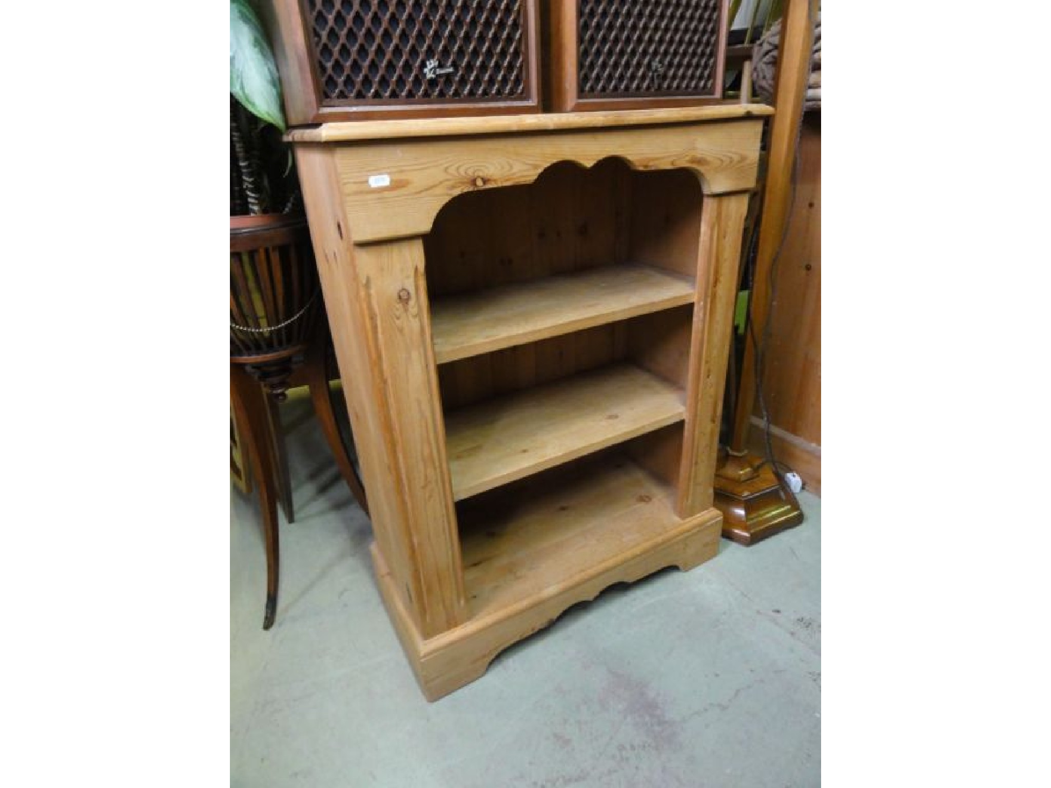 Appraisal: A pair of dwarf stripped pine freestanding open bookcases with