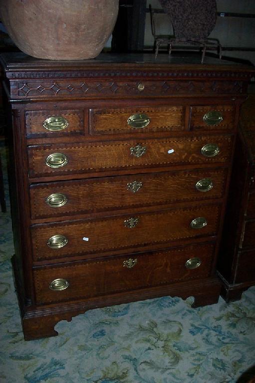 Appraisal: A Georgian oak chest of long and short drawers with