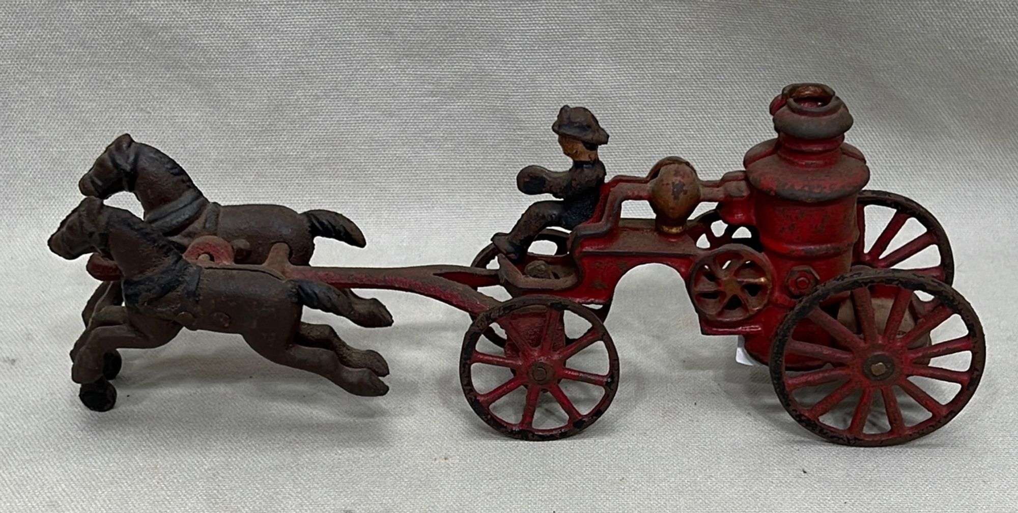 Appraisal: American cast iron horse-drawn fire pump toylate th to early