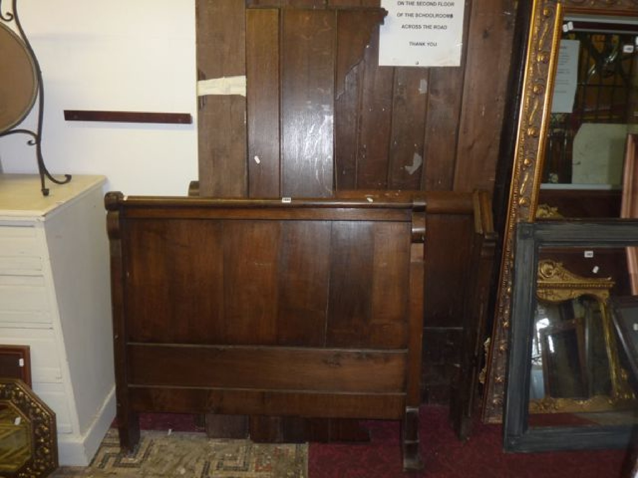 Appraisal: A continental oak single bedstead with scrolled ends cm wide