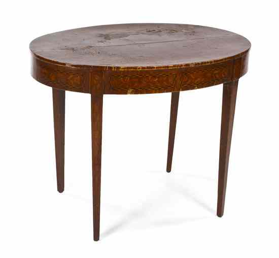 Appraisal: A Continental Marquetry Occasional Table the oval top raised on