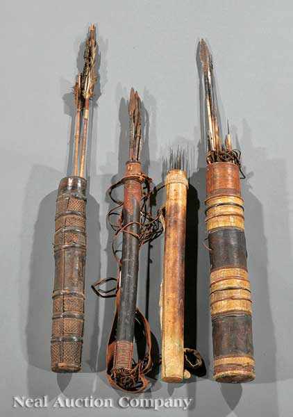 Appraisal: A Group of Four West African Carved Wood Hide-Bound Quivers