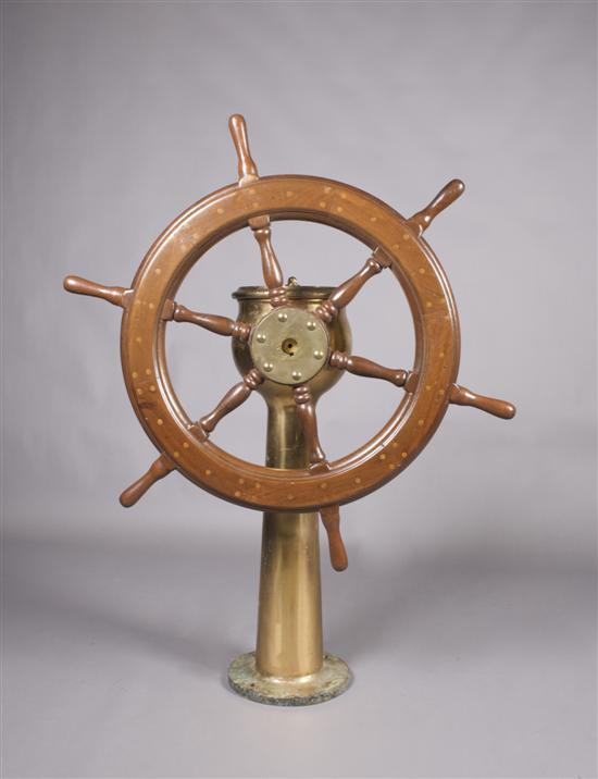 Appraisal: An American Brass and Wood Ships Wheel on Pedestal Dake