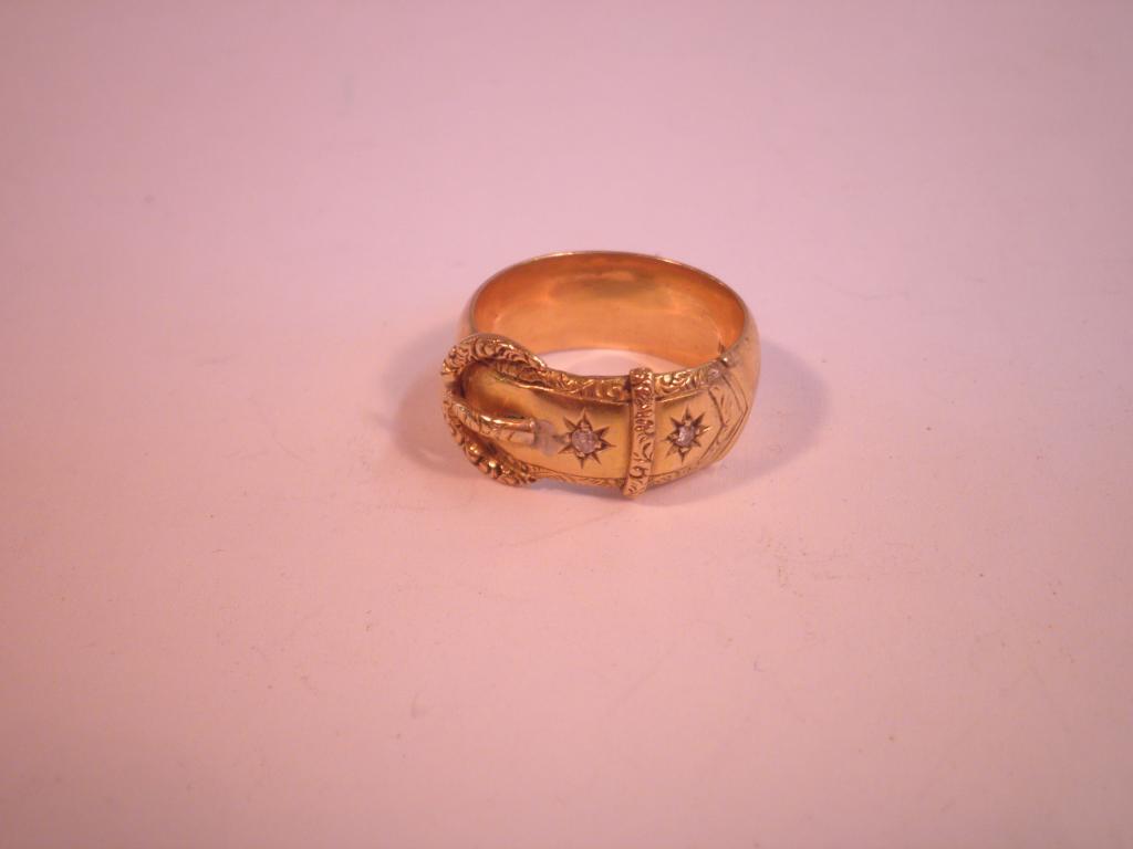 Appraisal: A Victorian yellow metal ring inset with two small diamond