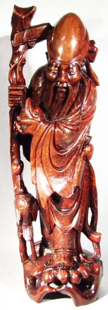 Appraisal: A Qing style Chinese teak figure of Shou-lao in typical