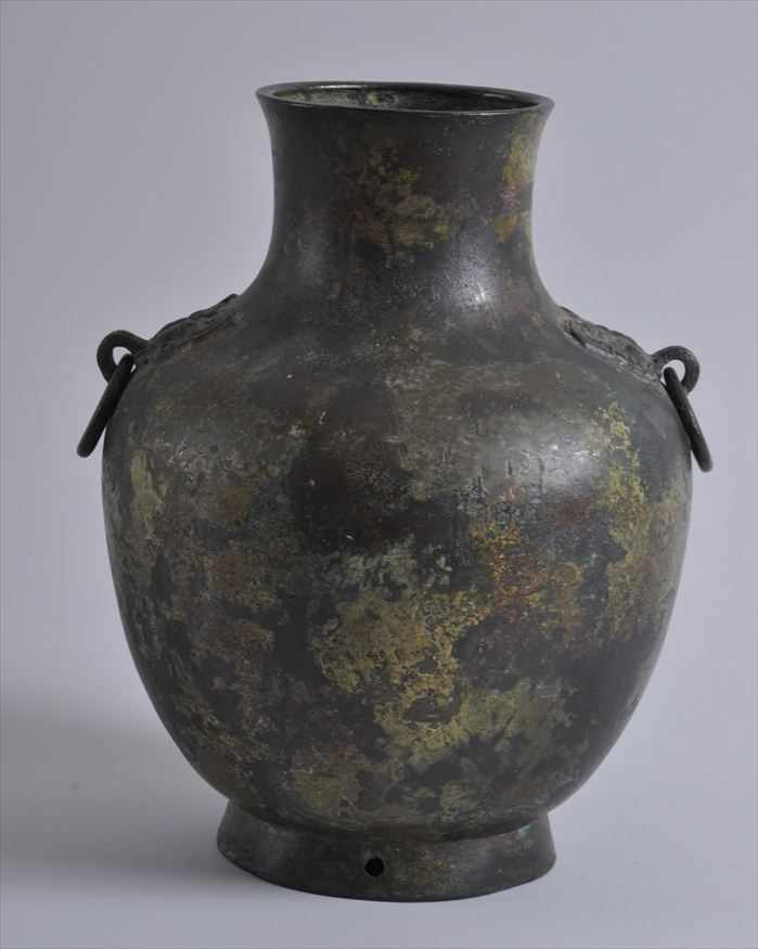 Appraisal: CHINESE BRONZE VESSEL The circular lip above the cylindrical neck