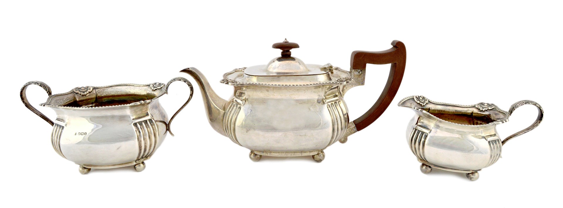 Appraisal: A silver three piece tea set comprising a teapot a