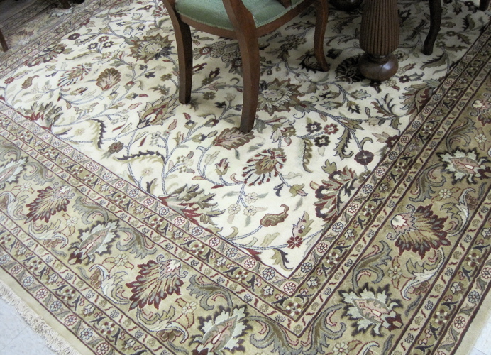 Appraisal: HAND KNOTTED ORIENTAL CARPET Indo-Persian overall floral vine design on