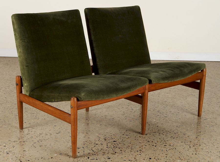 Appraisal: UPHOLSTERED TWO SEAT SETTEE MANNER OF FINN JUHL An upholstered