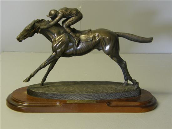 Appraisal: Bronze effect horse racing trophy on mahogany base with plaque