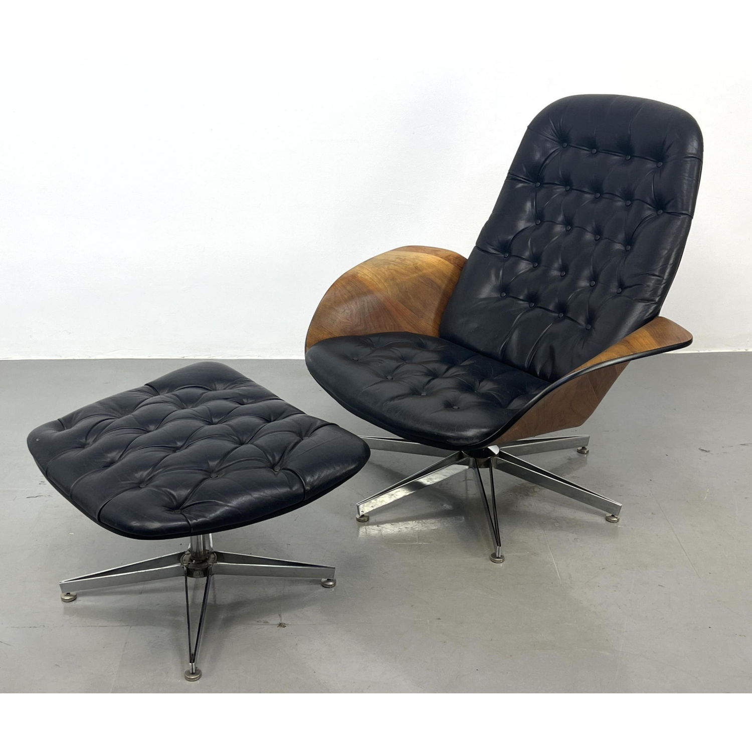 Appraisal: Leather PLYCRAFT Walnut Lounge Chair and Ottoman Designed by GEORGE