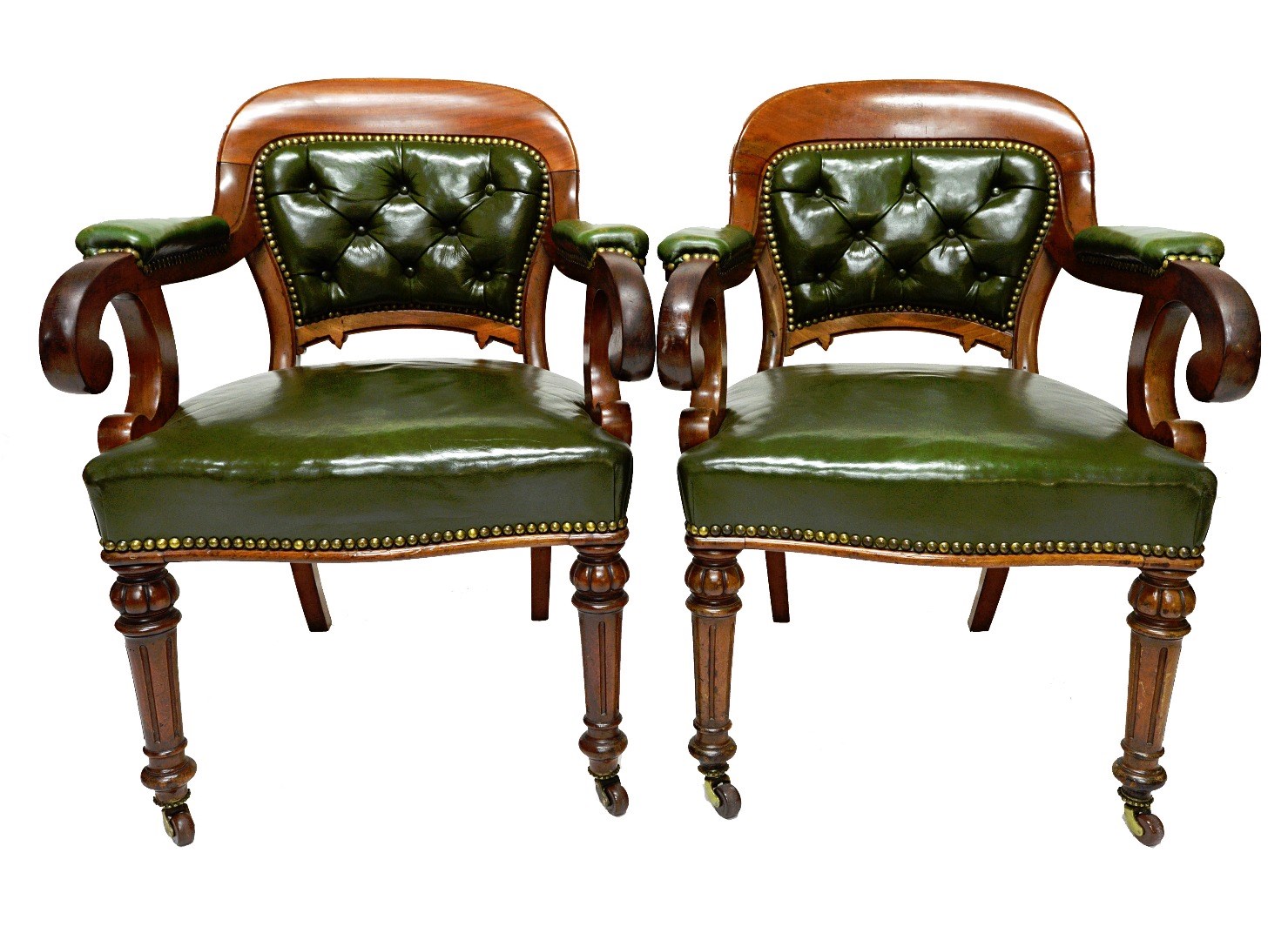 Appraisal: A pair of Victorian mahogany framed green leather upholstered open