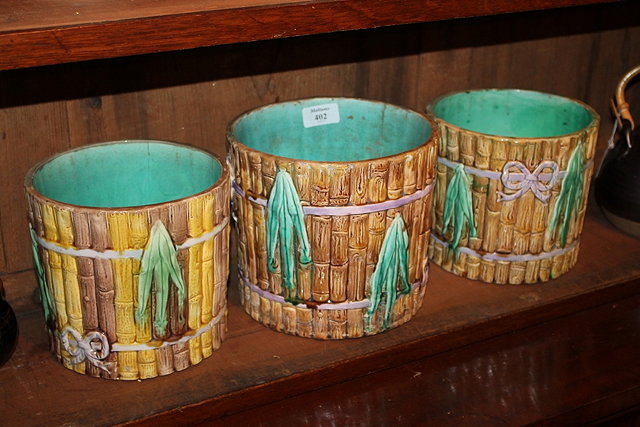 Appraisal: A PAIR OF MAJOLICA CIRCULAR PLANTERS with bamboo type decoration