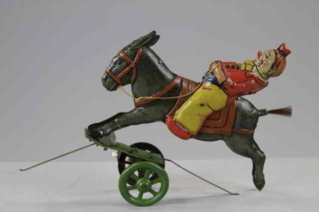 Appraisal: EINFALT CLOWN RIDING DONKEY Germany lithographed tin depicts clown in