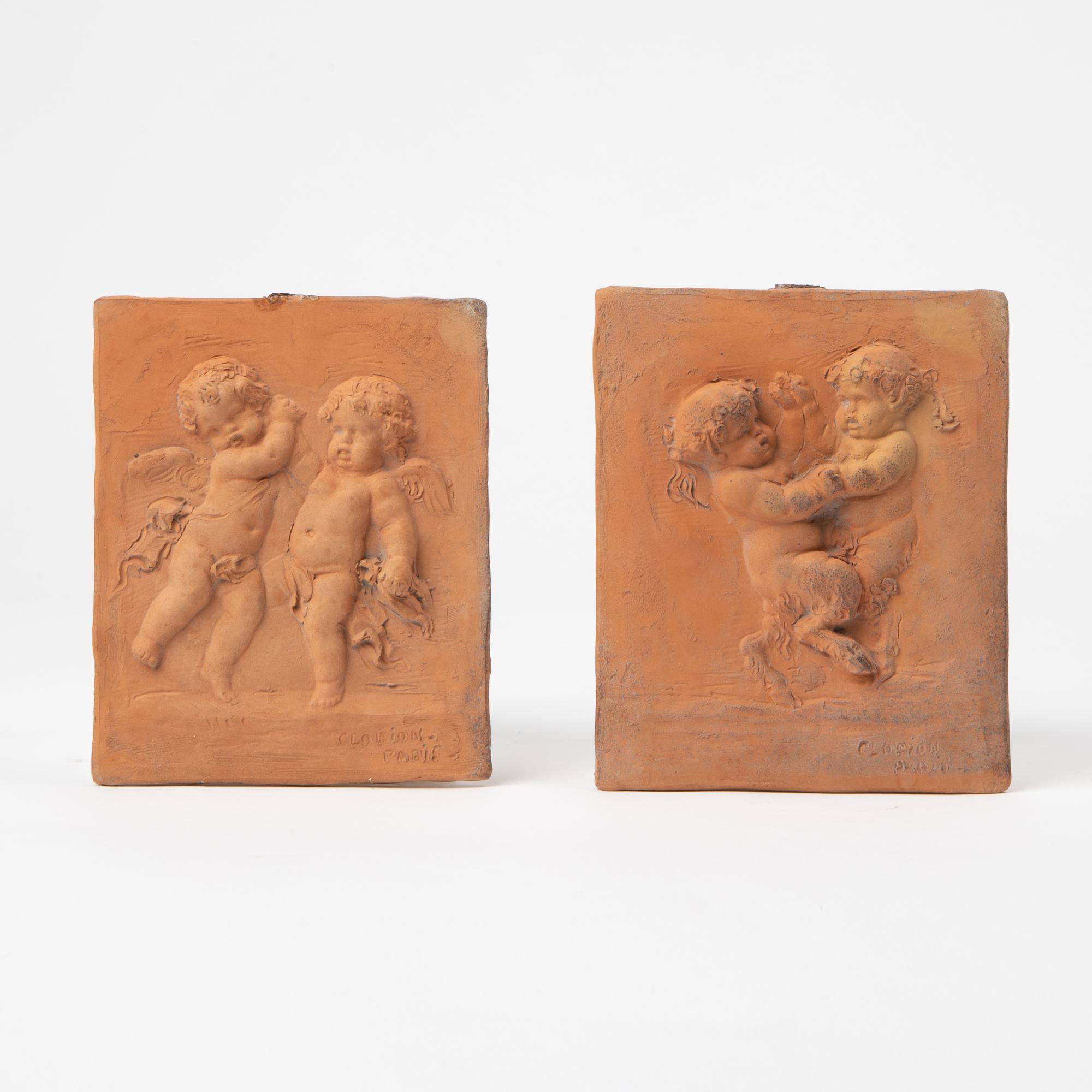 Appraisal: TWO TERRACOTTA PUTTO PLAQUES AFTER CLODION A fine pair of