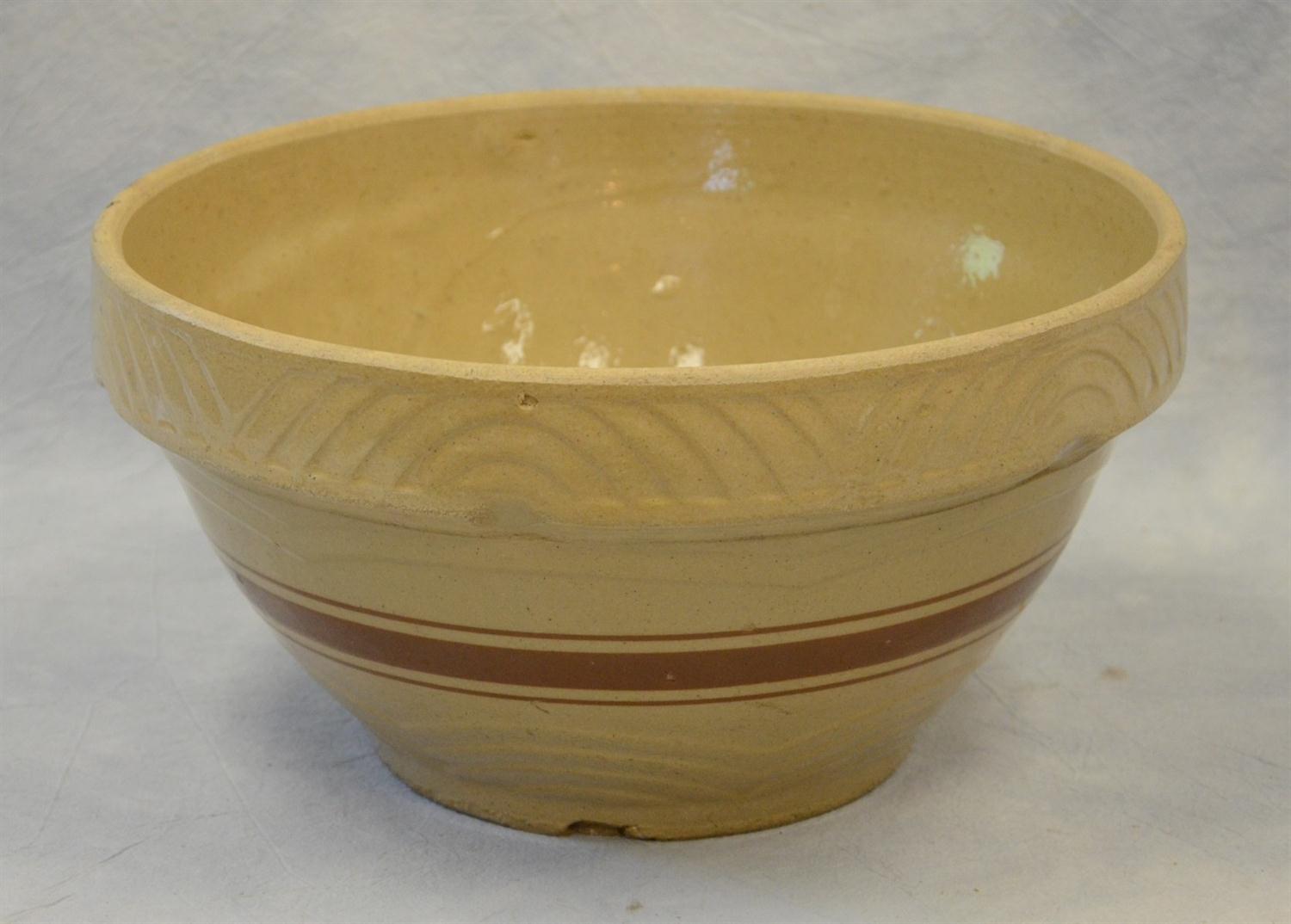 Appraisal: Large Yelloware Mixing Bowl with molded arch decoration and brown