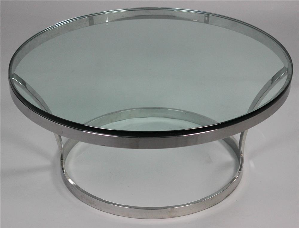 Appraisal: MODERN CIRCULAR CHROME AND GLASS COFFEE TABLE in glass atop