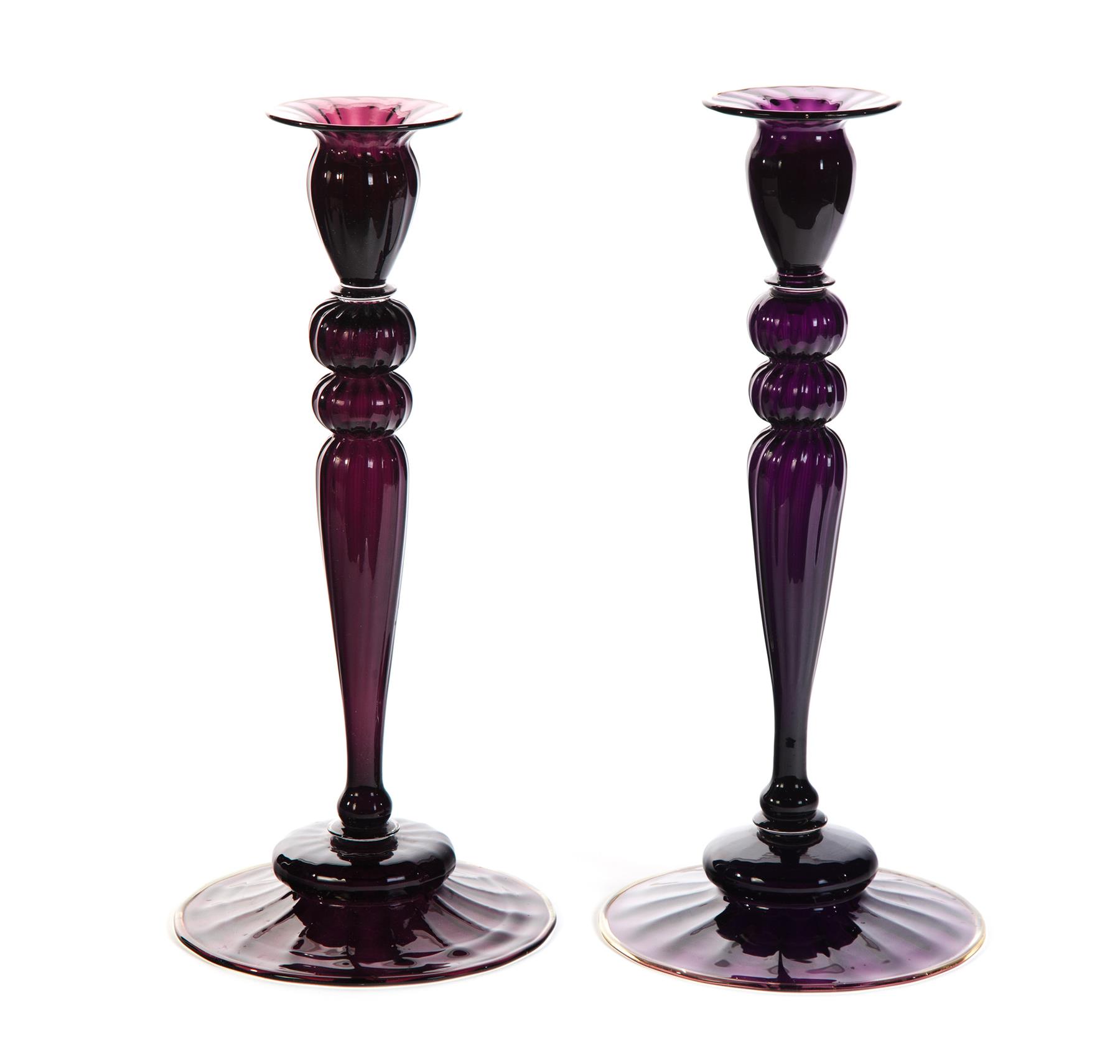 Appraisal: PAIR OF STEUBEN AMETHYST CANDLESTICKS American st quarter- th century