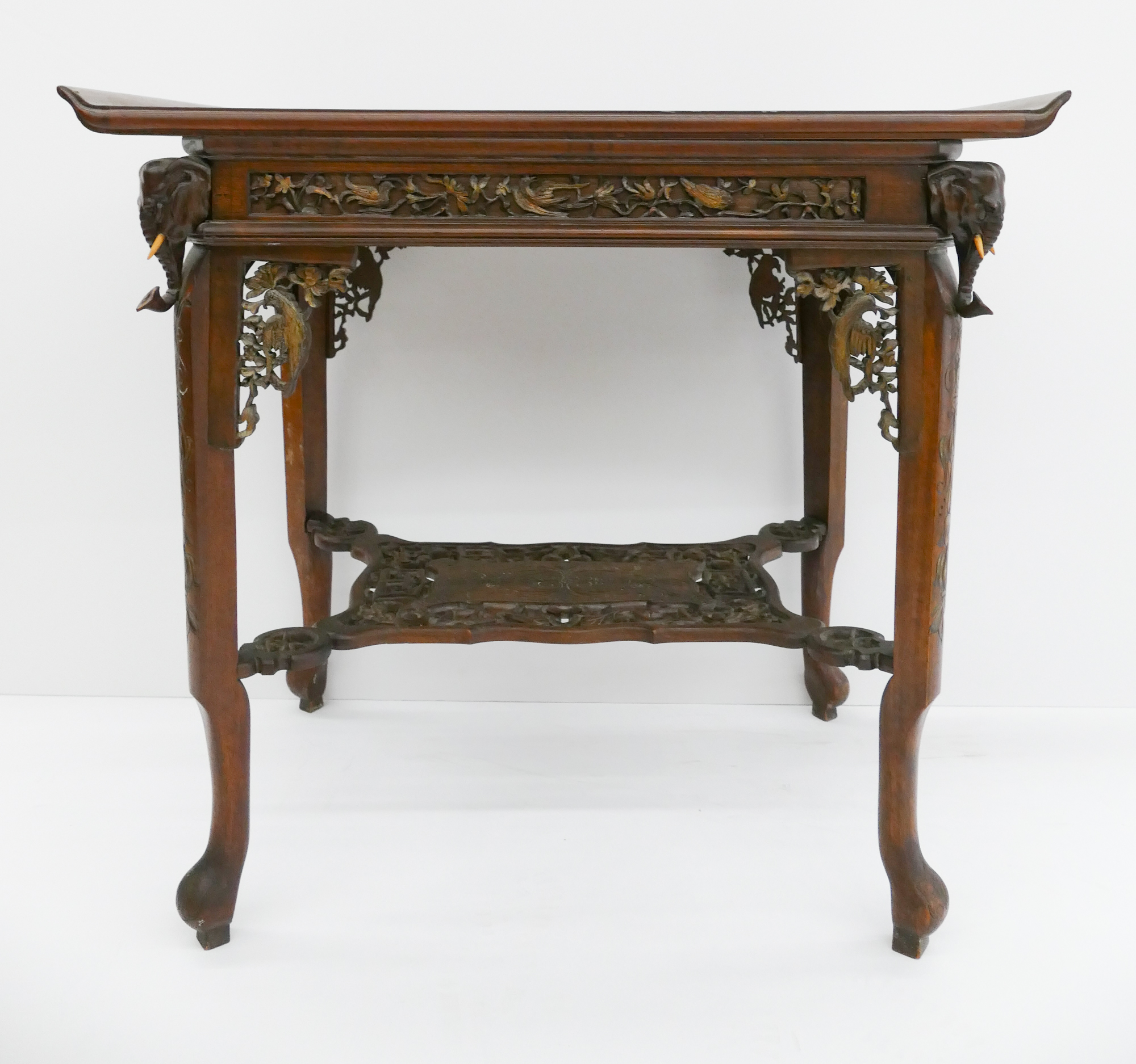 Appraisal: Anglo-Indian Elephant Head Occasional Table Elaborately carved shelf brackets and