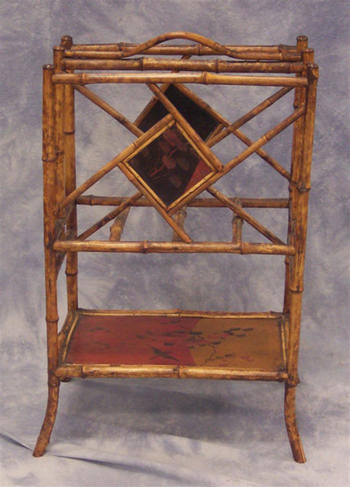 Appraisal: Bamboo magazine rack lacquered bottom shelf and side medallions h