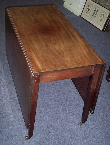 Appraisal: An early th Century mahogany two-flap dining table raised on