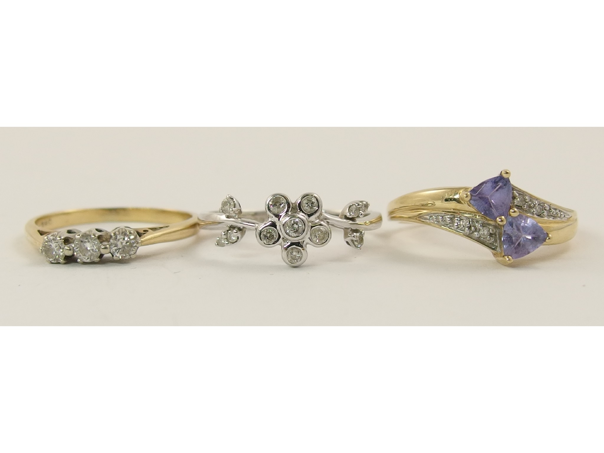 Appraisal: A ct diamond flower ring and two other ct diamond