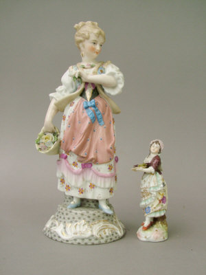 Appraisal: Sitzendorf figure of a lady carrying a basket of flowers