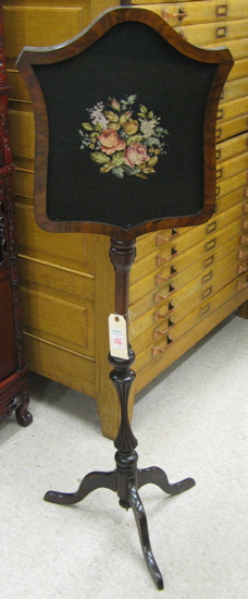 Appraisal: VICTORIAN POLE SCREEN American th century having an adjustable shield-shaped