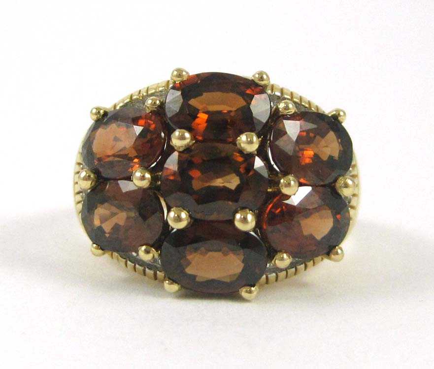 Appraisal: RED ORANGE GARNET AND FOURTEEN KARAT GOLD RING set with