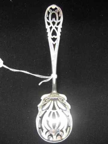 Appraisal: Sterling Silver Pea Serving Spoon elaborate pierced bowl handle Victorian