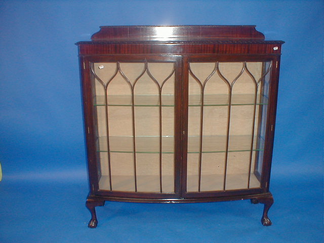 Appraisal: A 's mahogany bow front china cabinet with two glazed