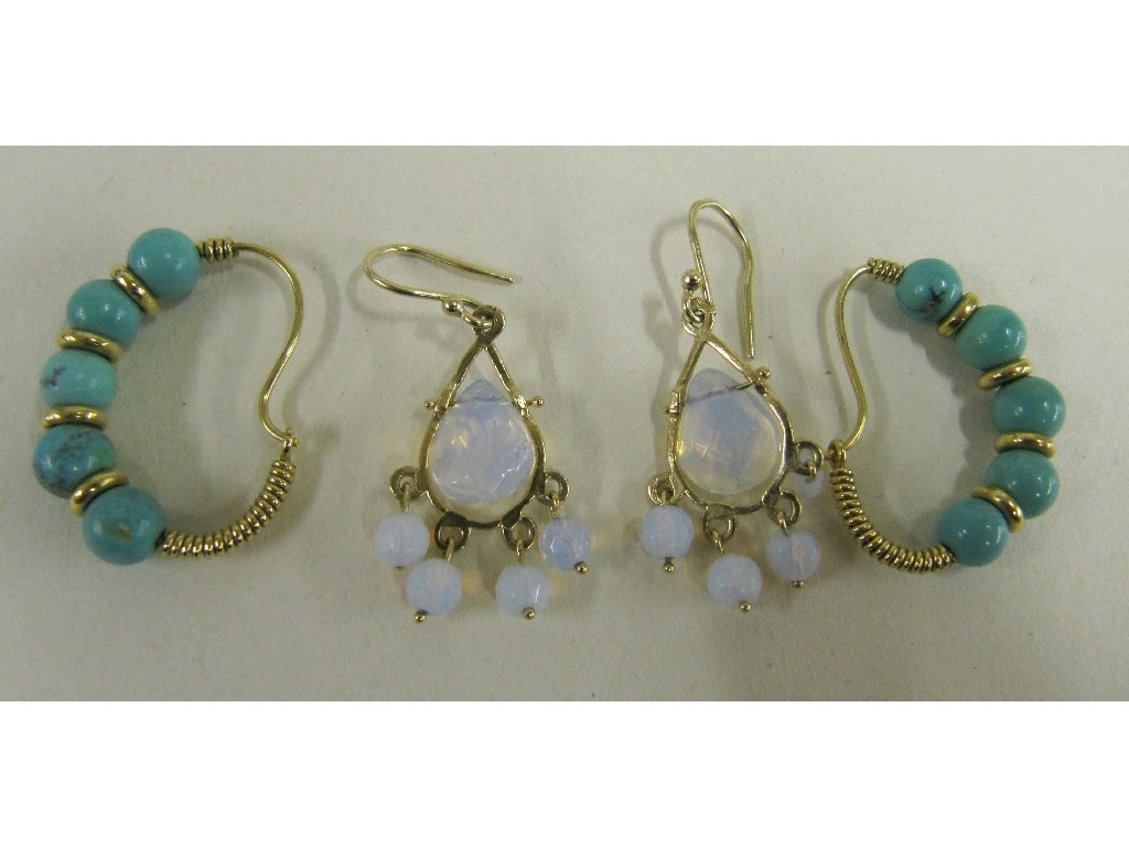 Appraisal: Lot comprising a pair of opalescent stone drop earrings and