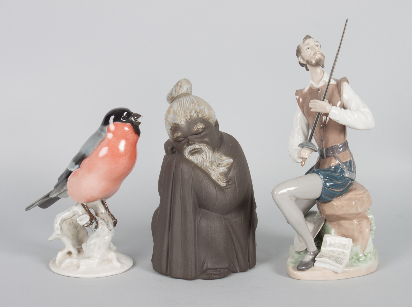 Appraisal: Two Lladro figures and Rosenthal songbird figures include Don Quixote