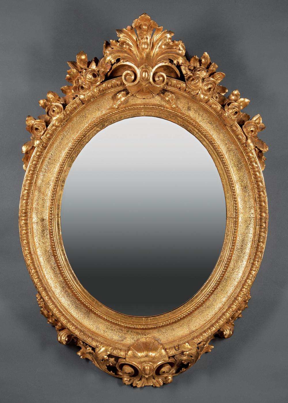 Appraisal: Pair of Continental Rococo-Style Giltwood Mirrors acanthus and rose-carved crest