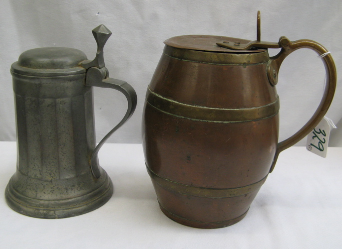 Appraisal: TWO GERMAN TH C METAL BEER STEINS One a barrel-shape