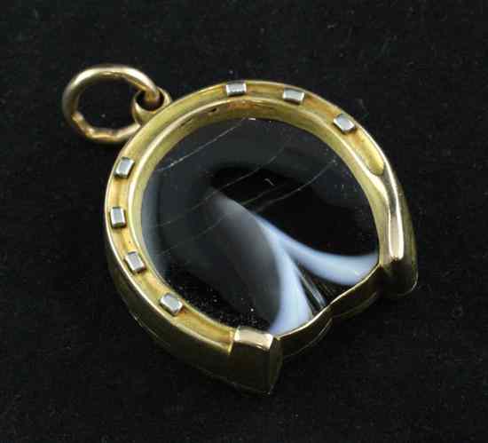 Appraisal: An Edwardian gold and agate locket fob modelled as a