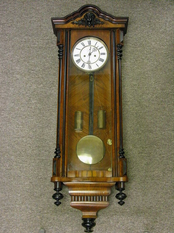 Appraisal: TALL GERMAN WALL CLOCK minerva face small veneer chip top