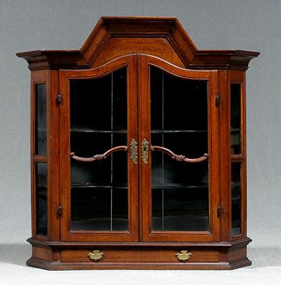 Appraisal: Continental baroque hanging cabinet arched glazed doors black painted shelved