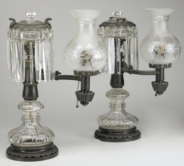 Appraisal: PAIR OF ARGAND LAMPS In bronze and clear glass with