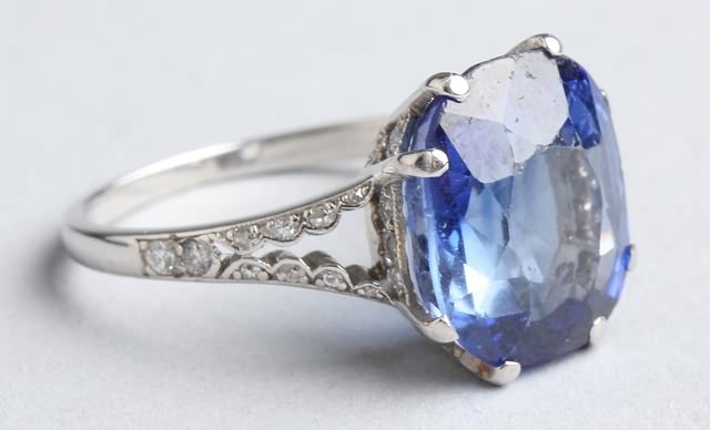 Appraisal: Platinum and synthetic sapphire and diamond ring One cushion cut