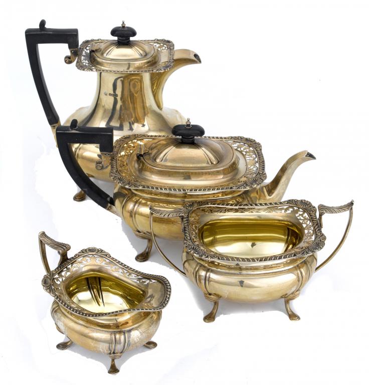 Appraisal: A GEORGE V FOUR-PIECE TEA SERVICE with widely everted saw