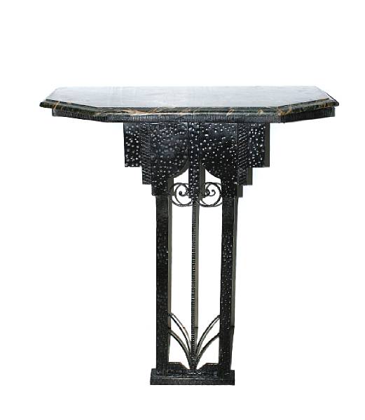 Appraisal: A pair of Art Deco style wrought iron marble topped