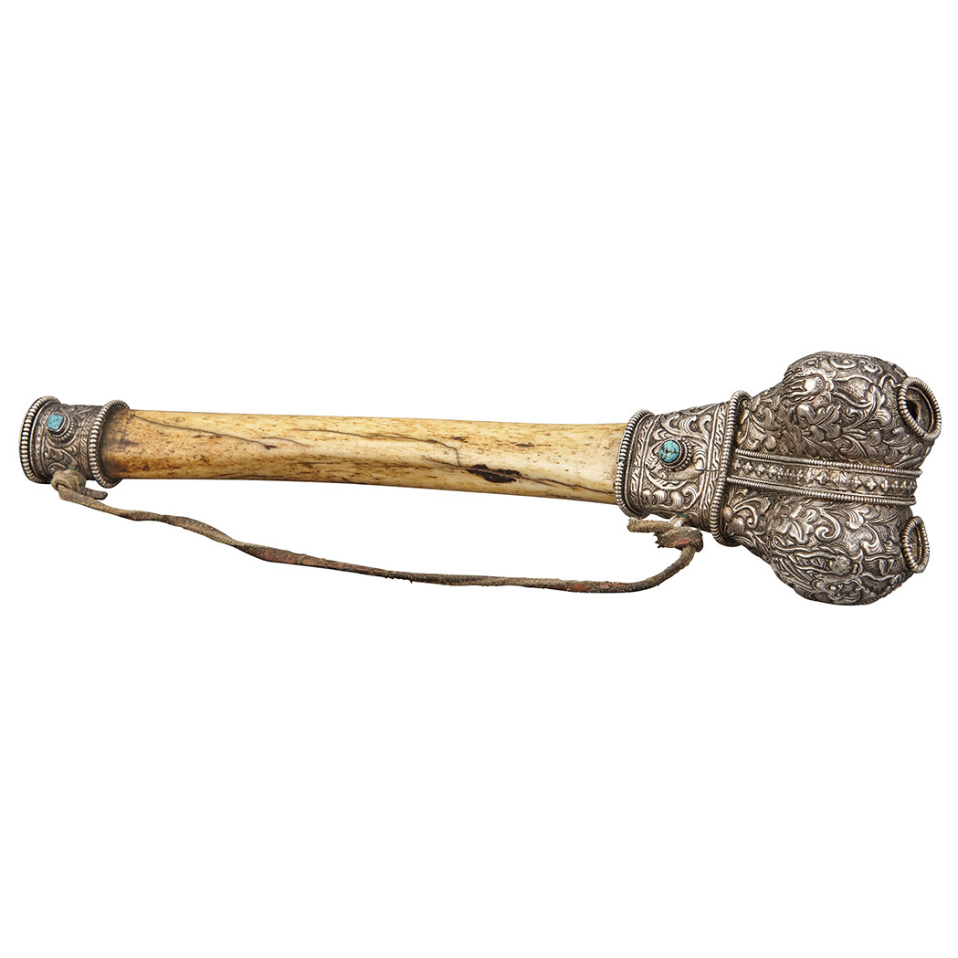 Appraisal: Tibetan Silver Mounted Bone Trumpet The bone shaft embellished with