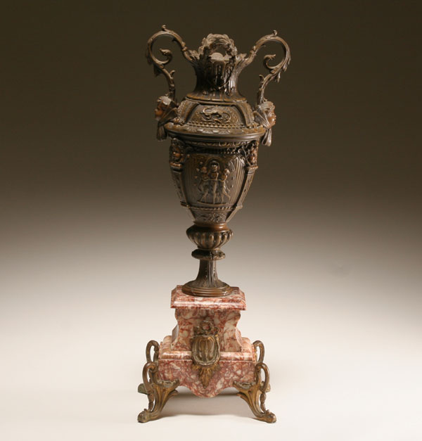 Appraisal: Neo-classical style patinated metal urn foliate form handles terminating in